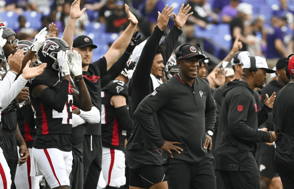 Aug 17, 2024; Baltimore, Maryland, USA; Atlanta Falcons head coach Raheem Morris and team react after kicker Younghoe Woo made field goal during the first half against the Baltimore Ravens at M&T Bank Stadium. Mandatory Credit: Tommy Gilligan-Imagn Images