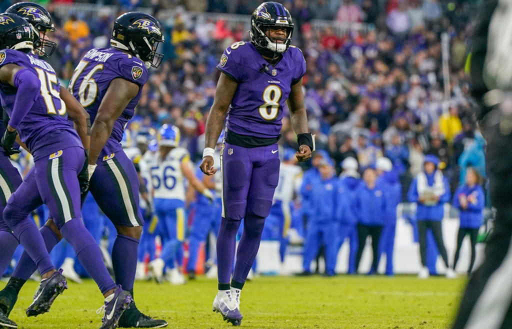 Dec 10, 2023; Baltimore, Maryland, USA; Baltimore Ravens quarterback Lamar Jackson (8) celebrates after the team scores a touchdown against the Los Angeles Rams during the fourth quarter at M&T Bank Stadium. Mandatory Credit: Jessica Rapfogel-Imagn Images