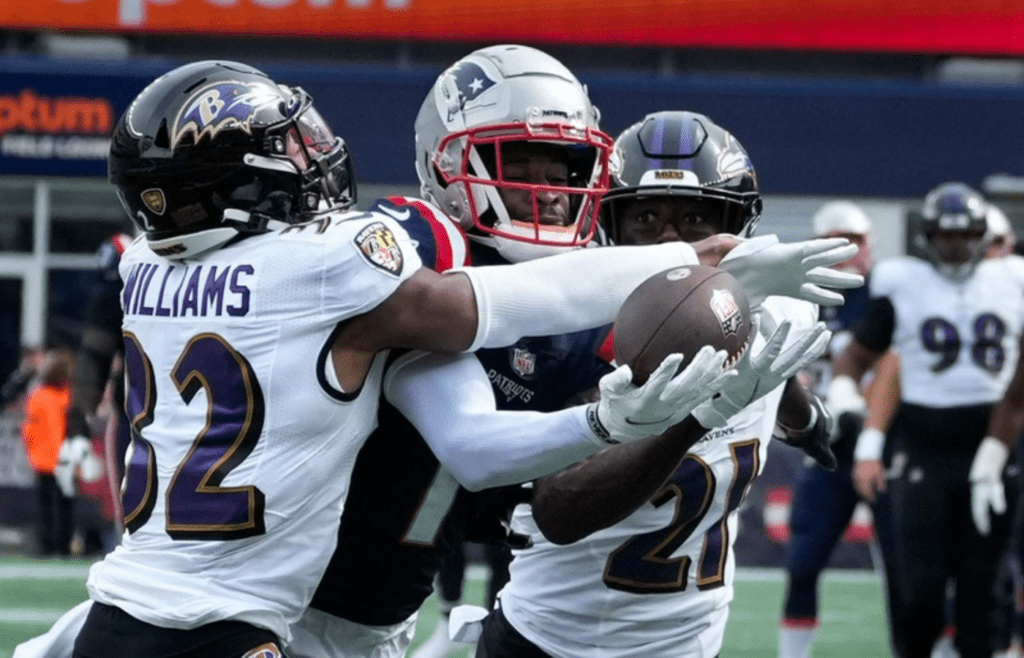 Patriots receiver DeVante Parker is denied a 2nd quarter completion by a double team defense from Baltimore's Marcus Williams and Brandon Stephens. No interference call on the play. [The Providence Journal / Kris Craig]