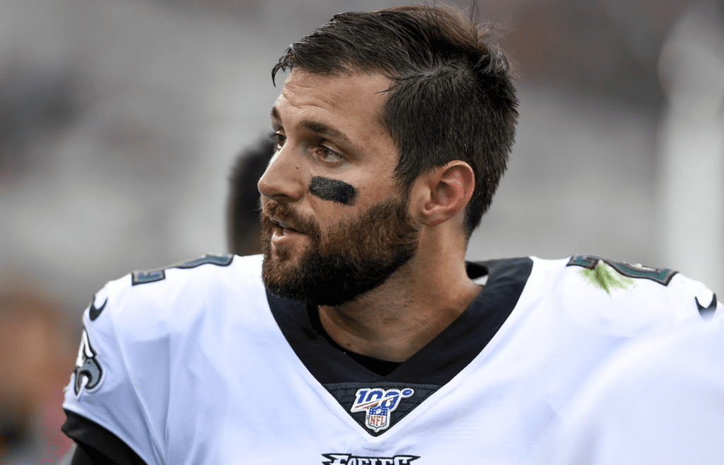 Aug 15, 2019; Jacksonville, FL, USA; Philadelphia Eagles quarterback Cody Kessler (2) is walked off the field by training staff during the first quarter against the Jacksonville Jaguars at TIAA Bank Field. Mandatory Credit: Douglas DeFelice-Imagn Images