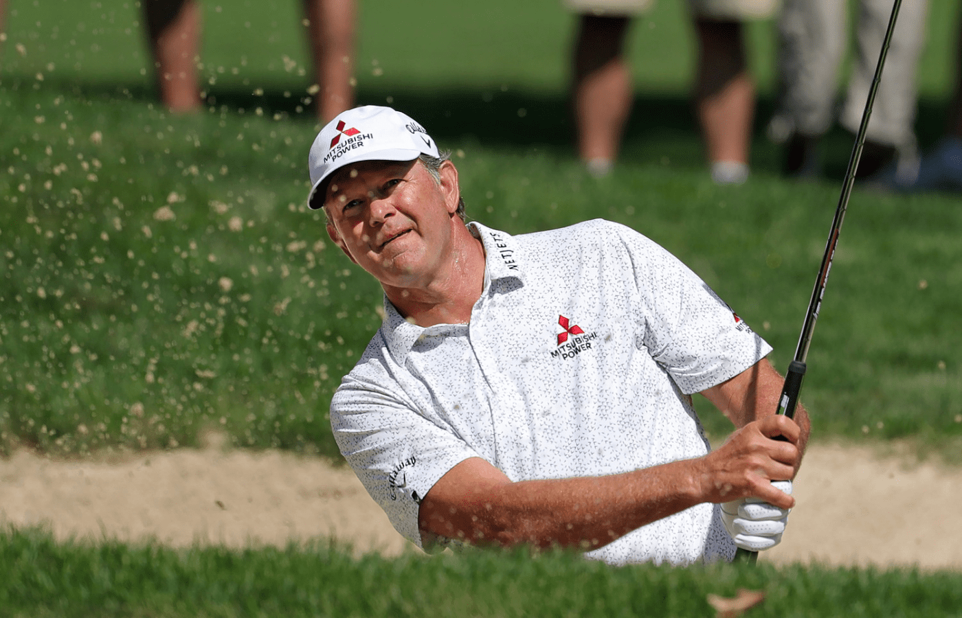 Retief Goosen plays a shot from a bunker on the tenth hole during the second round of the Kaulig Companies Championship at Firestone Country Club, Friday, July 12, 2024, in Akron, Ohio.