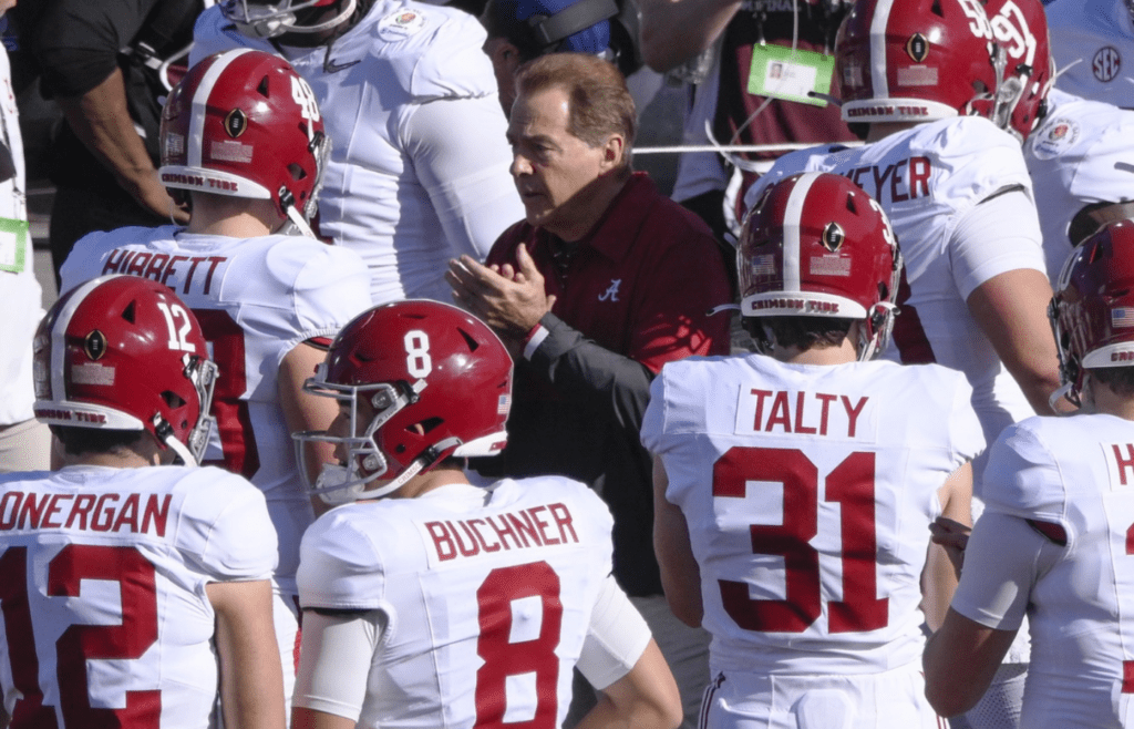 Jan 1, 2024; Pasadena, CA, USA; Alabama Crimson Tide head coach Nick Saban with his team as they take the field for pregame warmups before the 2024 Rose Bowl college football playoff semifinal game at Rose Bowl. Mandatory Credit: Robert Hanashiro-Imagn Images