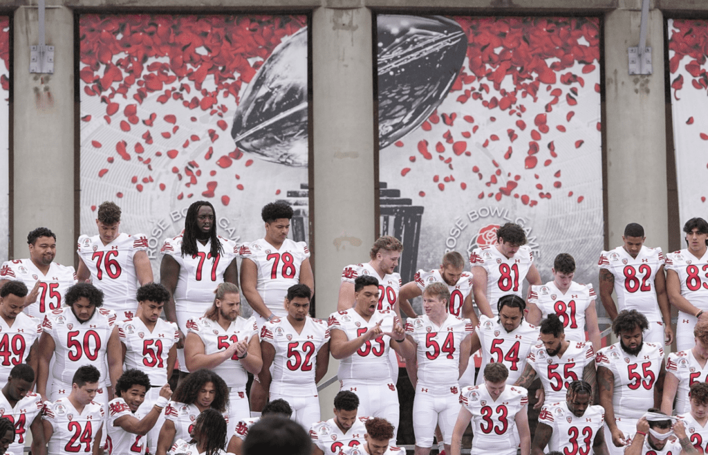 The Utah Utes take a team photo outside the Rose Bowl stadium in Pasadena, Calif. on Dec. 30, 2021. College Football Rose Bowl