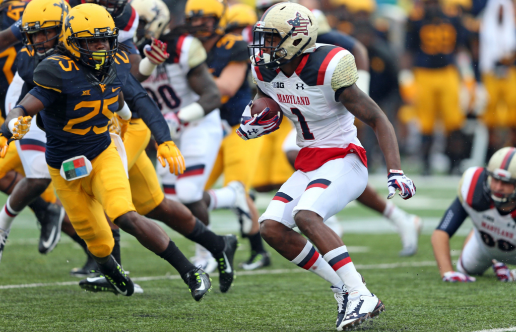 Sep 13, 2014; College Park, MD, USA; Maryland Terrapins kick returner Stefon Diggs (1) is pursued by West Virginia Mountaineers special teams player Dayron Wilson (25) at Byrd Stadium. Mandatory Credit: Mitch Stringer-Imagn Images