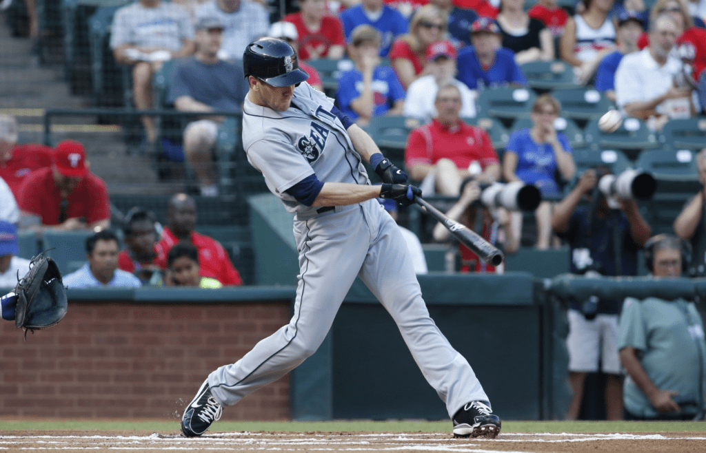 Jul 3, 2013; Arlington, TX, USA; Seattle Mariners right fielder Jason Bay (12) his a home run in the first inning of the game against the Texas Rangers at the Rangers Ballpark in Arlington. Mandatory Credit: Tim Heitman-Imagn Images