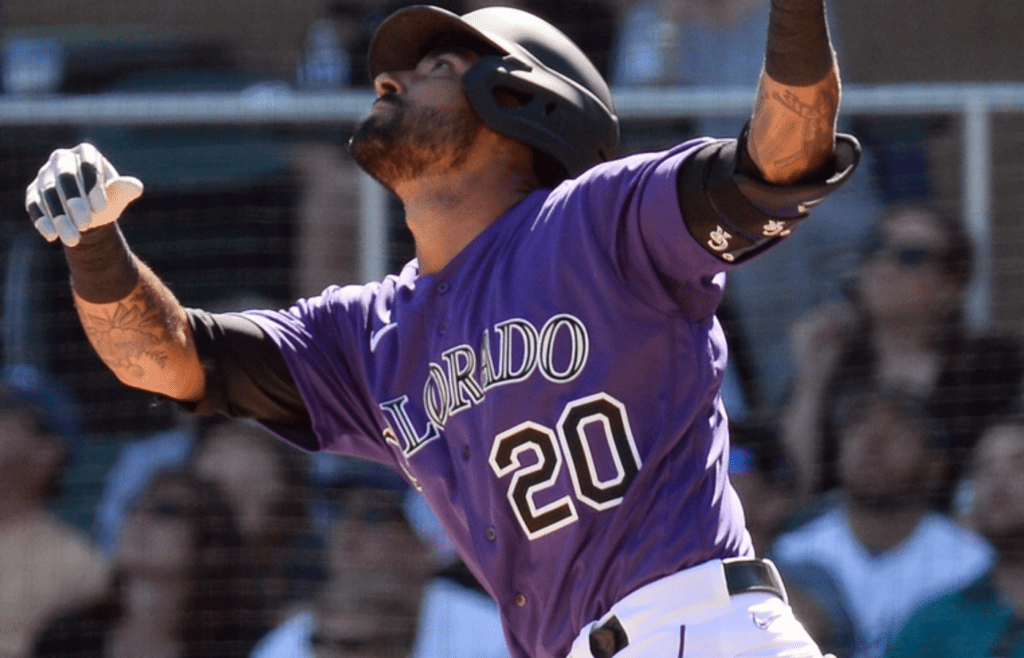 Feb 29, 2020; Salt River Pima-Maricopa, Arizona, USA; Colorado Rockies center fielder Ian Desmond (20) flips his bat as he flies out against the Los Angeles Dodgers during the second inning of a spring training game at Salt River Fields at Talking Stick. Mandatory Credit: Joe Camporeale-Imagn Images