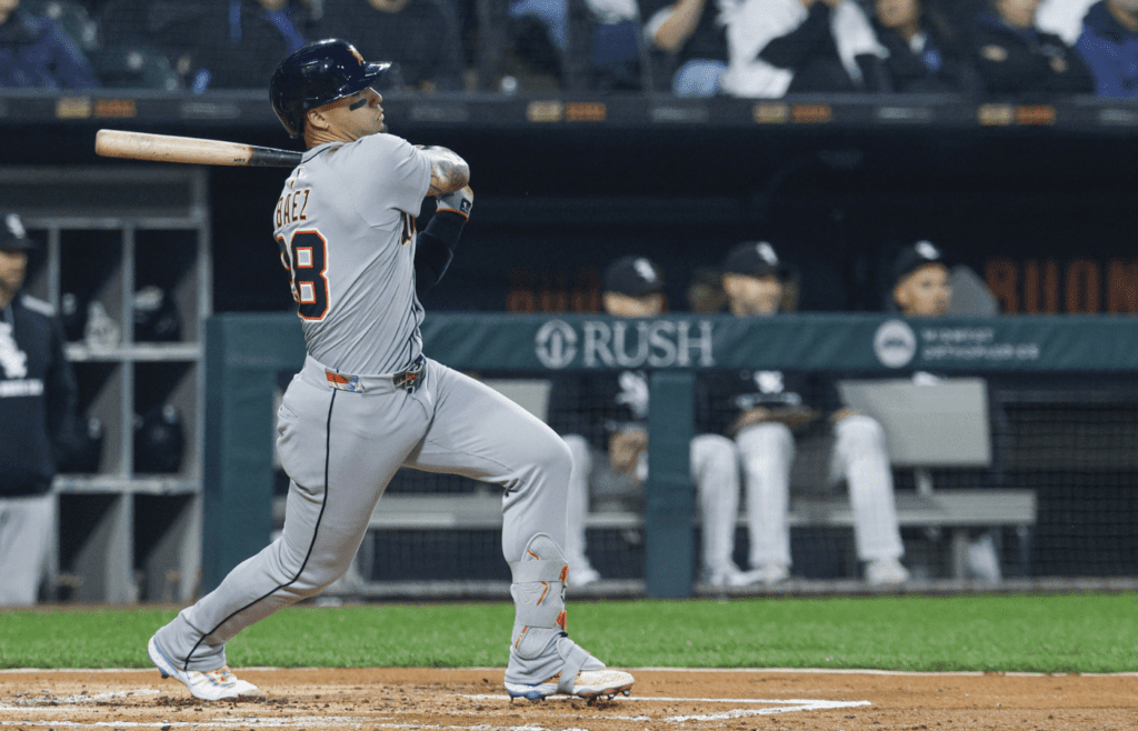 Jun 4, 2025; Chicago, Illinois, USA; Detroit Tigers center fielder Javier Baez (28) hits an RBI-single against the Chicago White Sox during the first inning at Rate Field. Mandatory Credit: Kamil Krzaczynski-Imagn Images