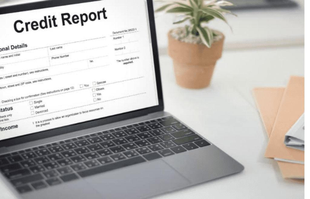 A laptop open to a credit report site