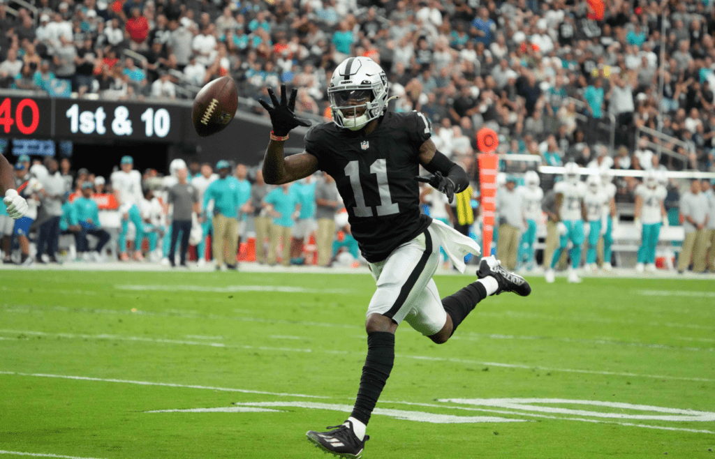 Sep 26, 2021; Paradise, Nevada, USA; Las Vegas Raiders wide receiver Henry Ruggs III (11) attempts to catch a pass in the second half against the Miami Dolphins at Allegiant Stadium.The Raiders defeated the Dolphins 31-28 in overtime. Mandatory Credit: Kirby Lee-Imagn Images