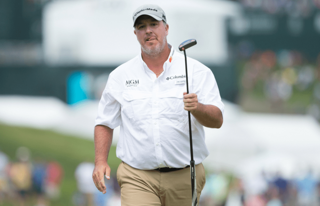 Boo Weekley reacts to his putt attempt on the 1st hole during the final round of the Travelers Championship golf tournament at TPC River Highlands