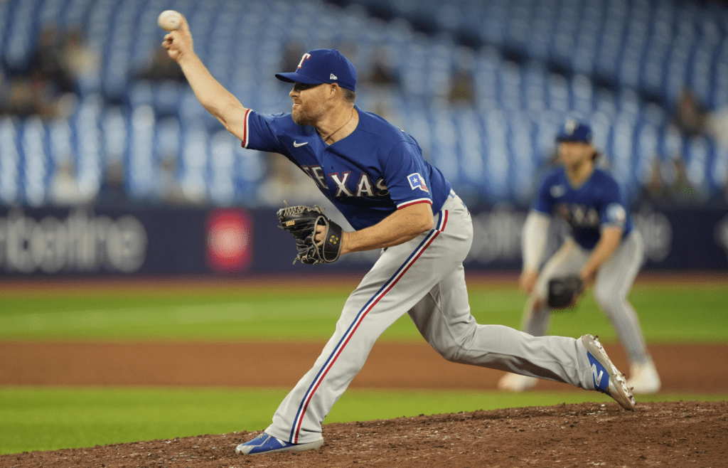Texas Rangers pitcher Ian Kennedy (21) pitches to the Toronto Blue Jays during the ninth inning at Rogers Centre