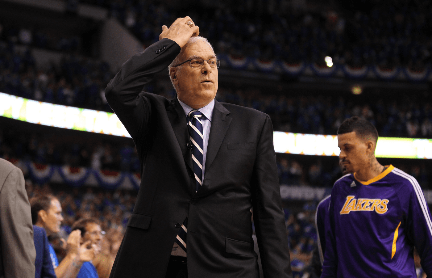 Los Angeles Lakers head coach Phil Jackson scratches his head while walking off the court at the end of the game three against the Dallas Mavericks of the second round of the 2011 NBA playoffs at American Airlines Center. The Mavs beat the Lakers 98-92