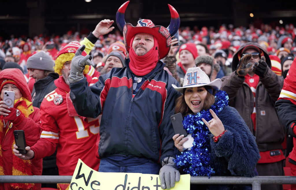 Houston Texans fans react during the first quarter of a 2025 AFC divisional round game against the Kansas City Chiefs at GEHA Field at Arrowhead Stadium