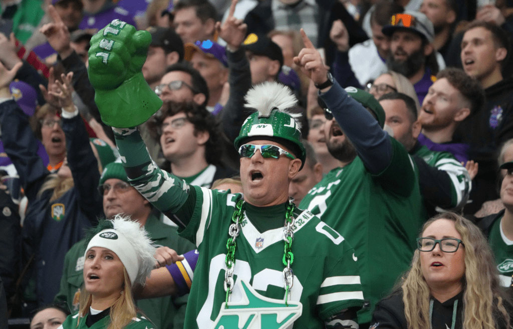 A New York Jets fan in costume reacts against the Minnesota Vikings in the second half at Tottenham Hotspur Stadium