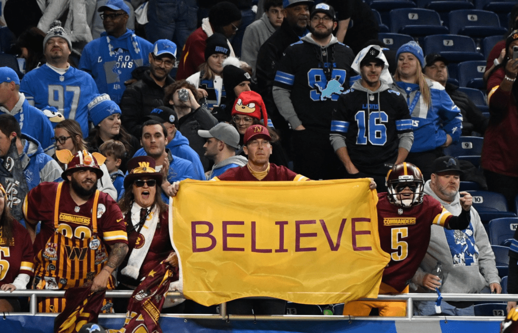 Washington Commanders fans react during the fourth quarter against Detroit Lions in a 2025 NFC divisional round game at Ford Field.