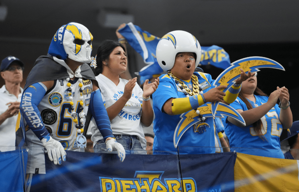 Los Angeles Chargers fans in costumes react against the Los Angeles Rams in the second half at SoFi Stadium.
