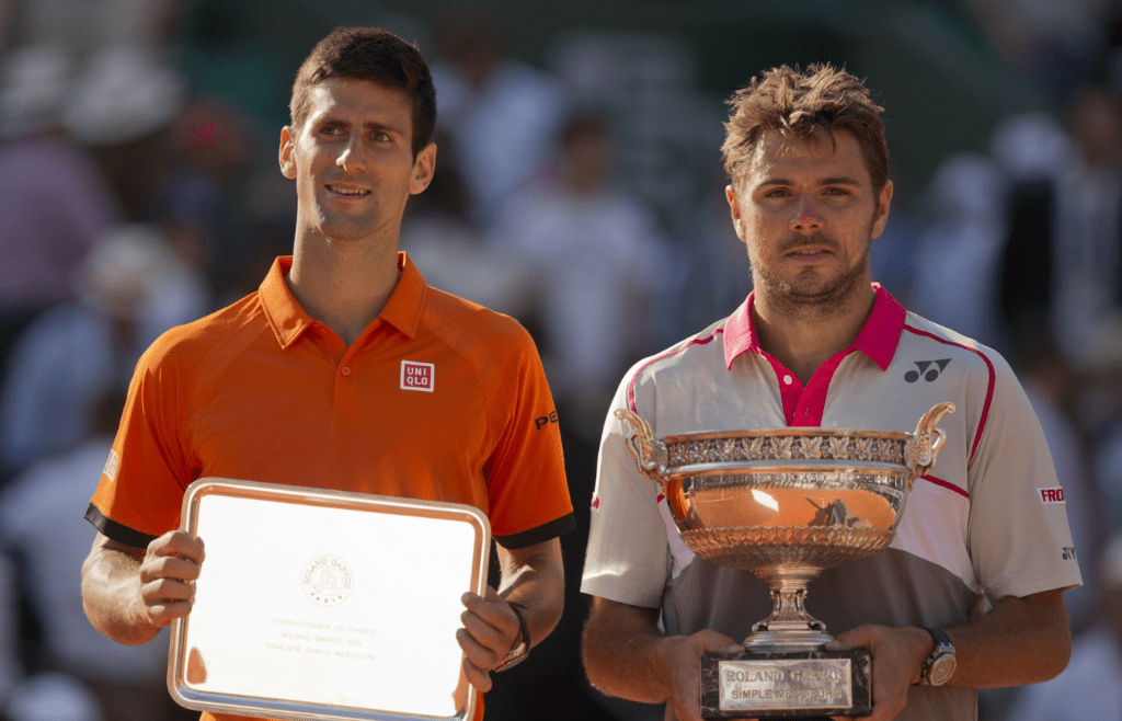 Novak Djokovic (SRB) and Stan Wawrinka (SUI) during the trophy presentation after their match on day 15 of the 2015 French Open at Roland Garros