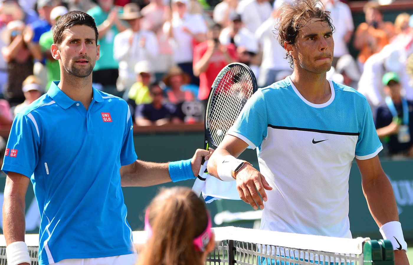 Novak Djokovic (SRB) shakes hands with Rafael Nadal (ESP) after their semifinal match in the BNP Paribas Open at the Indian Wells Tennis Garden. Djokovic won 7-6, 6-3