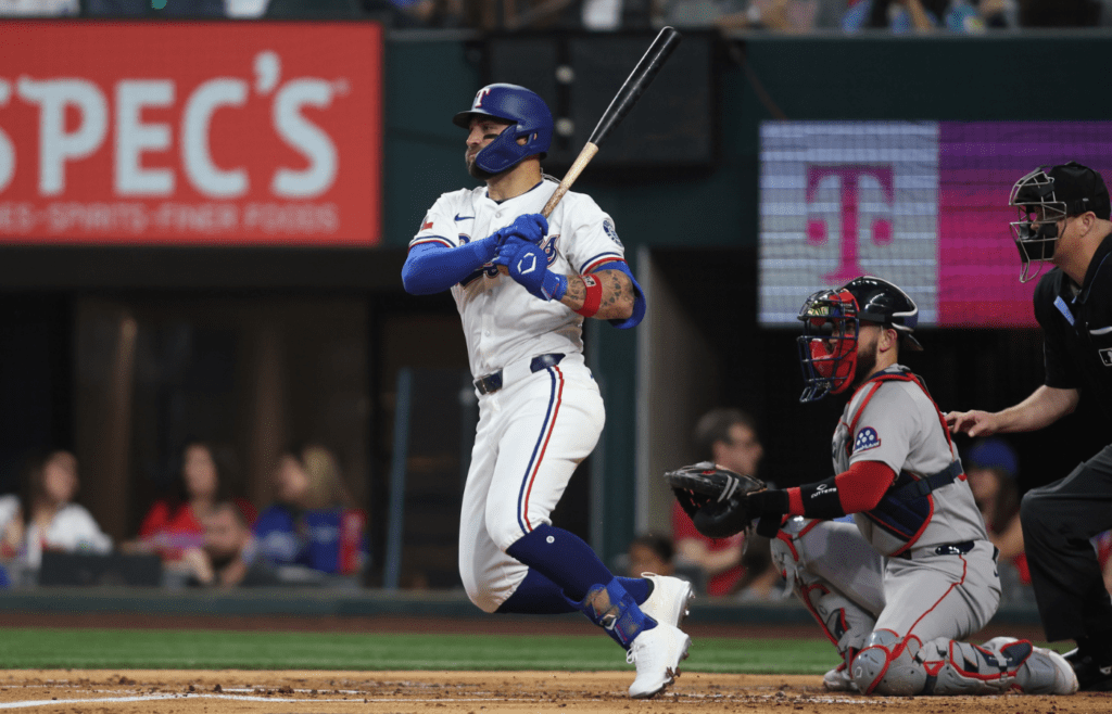 Texas Rangers outfielder Kevin Pillar (1) singles in a run during the second inning against the Boston Red Sox at Globe Life Field.