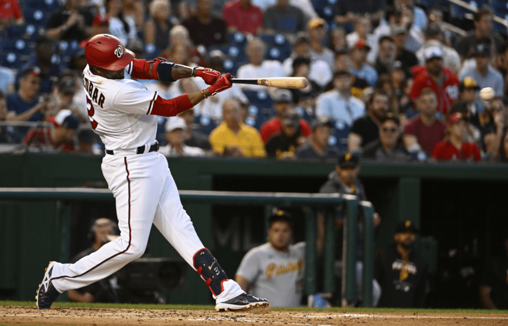District of Columbia, USA; Washington Nationals shortstop Alcides Escobar (3) hits a single against the Pittsburgh Pirates during the fourth inning at Nationals Park