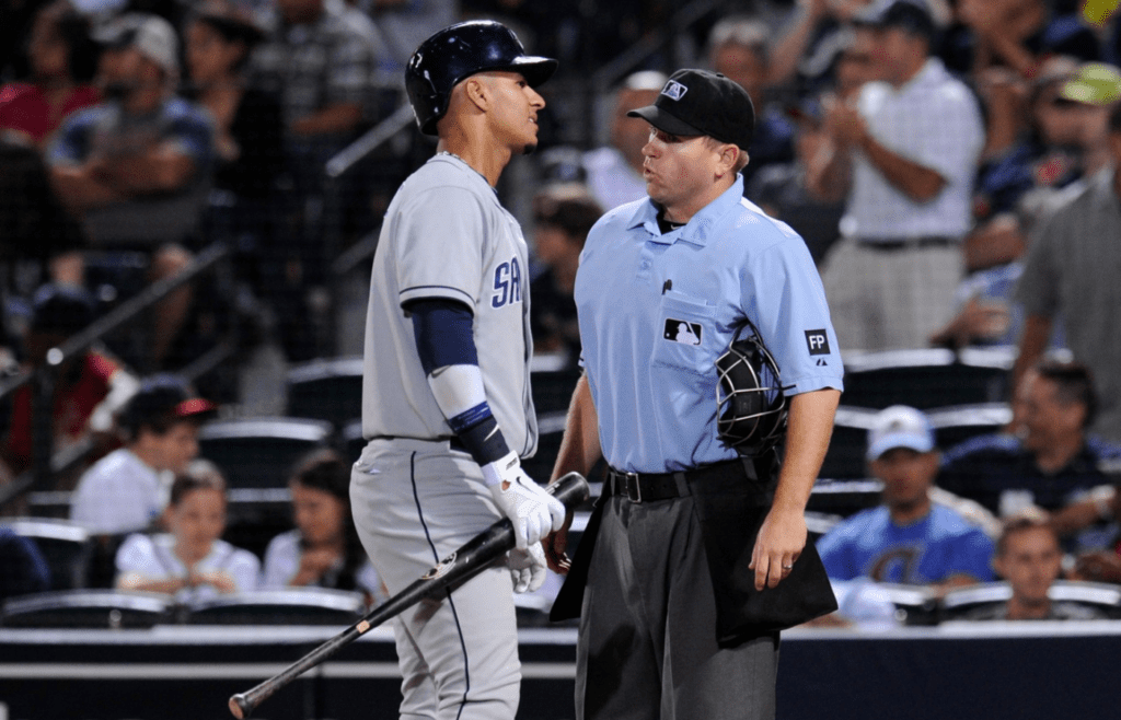 San Diego Padres shortstop Ronny Cedeno (3) reacts to umpire Mike Muchlinski (76) after striking out against the Atlanta Braves during the fourth inning at Turner Field