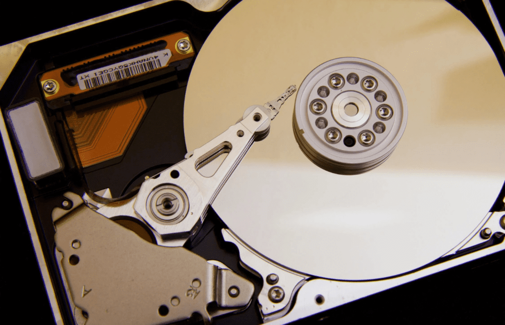 A large silver disc next to a VHS
