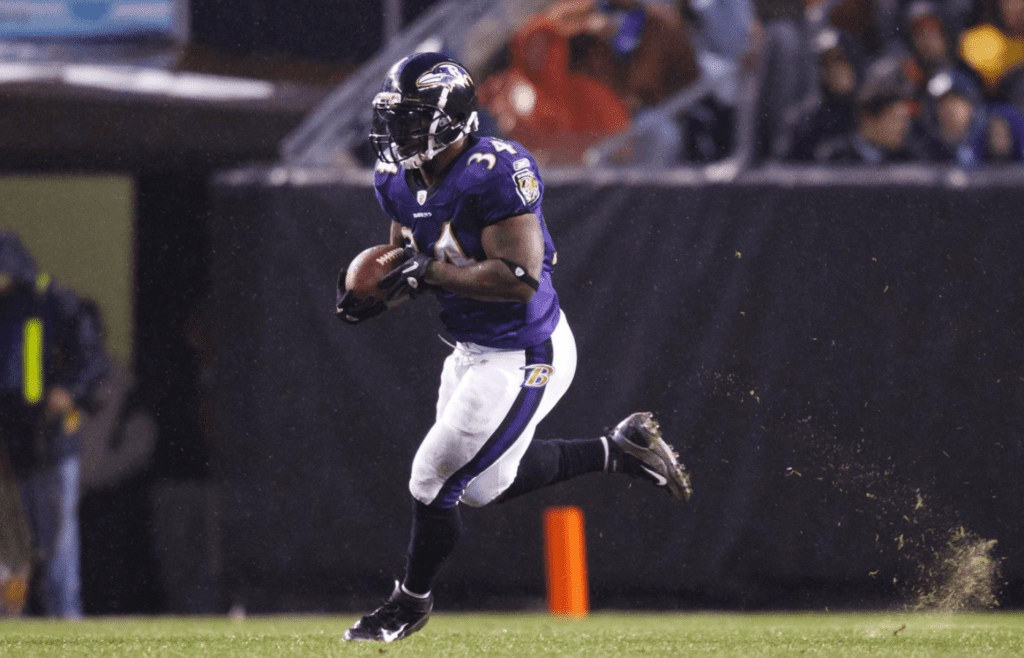 Dec 4, 2011; Cleveland, OH, USA; Baltimore Ravens running back Ricky Williams (34) runs the ball against the Cleveland Browns at Cleveland Browns Stadium. Mandatory Credit: Rick Osentoski-Imagn Images
