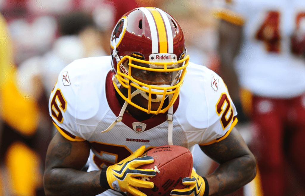 Aug 21, 2010; Landover, MD, USA; Washington Redskins running back Clinton Portis warms up before the start of a preseason game against the Baltimore Ravens at FedEx FIeld. Mandatory Credit: James Lang-Imagn Images