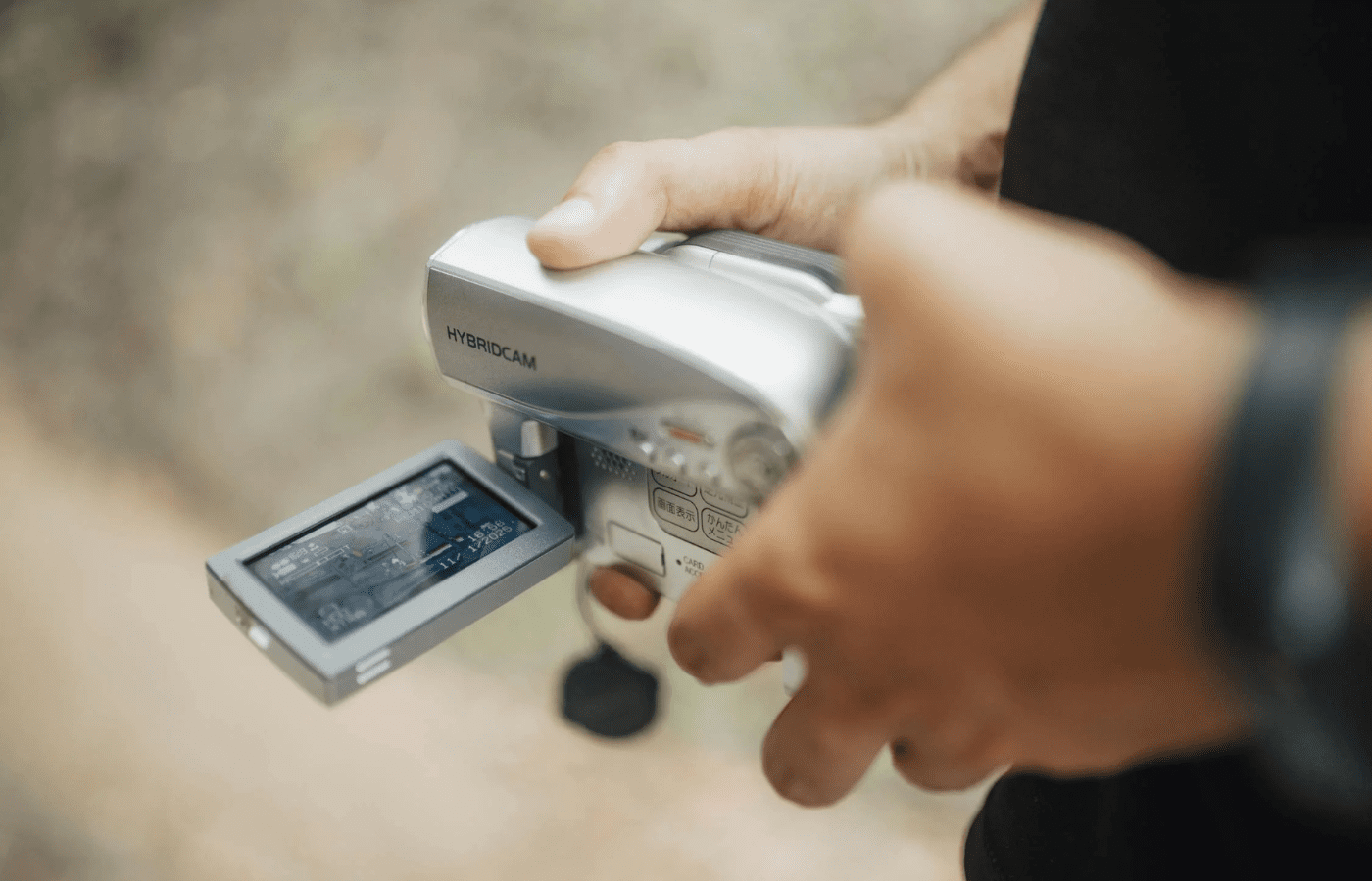 A small handheld video cam with a USB stick