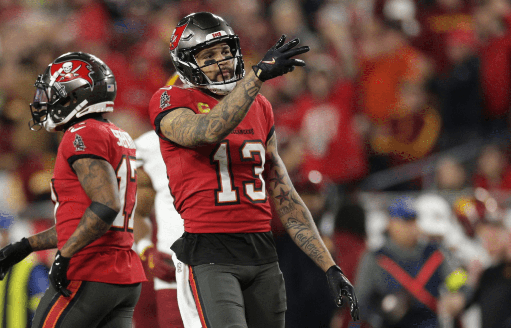 Jan 12, 2025; Tampa, Florida, USA; Tampa Bay Buccaneers wide receiver Mike Evans (13) reacts after a first down during the third quarter of a NFC wild card playoff against the Washington Commanders at Raymond James Stadium. Mandatory Credit: Nathan Ray Seebeck-Imagn Images