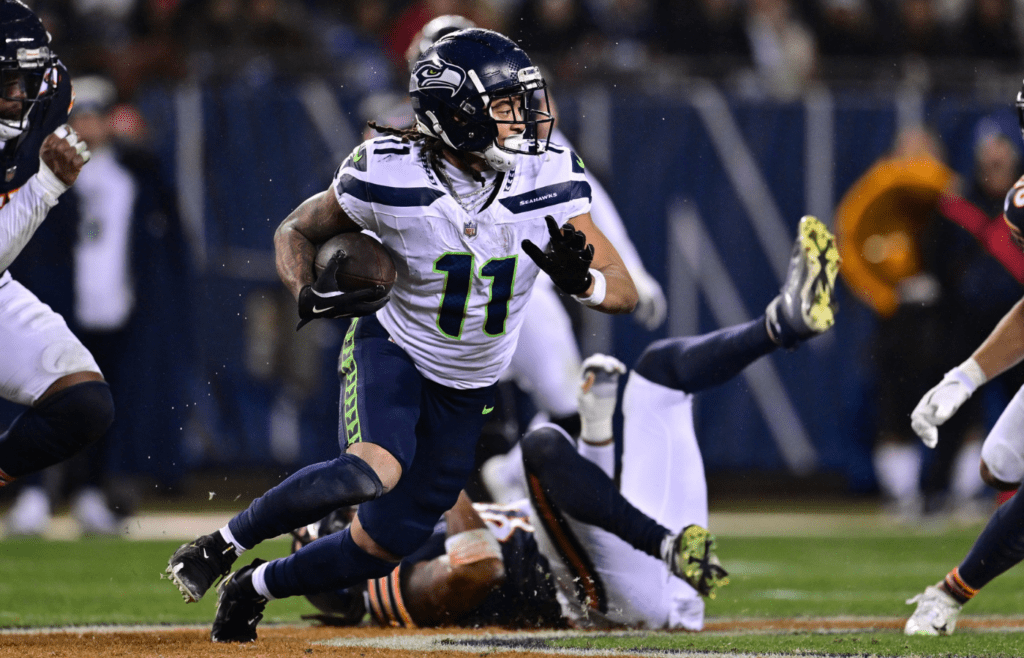 Dec 26, 2024; Chicago, Illinois, USA; Seattle Seahawks wide receiver Jaxon Smith-Njigba (11) runs after a catch against the Chicago Bears during the third quarter at Soldier Field. Mandatory Credit: Daniel Bartel-Imagn Images