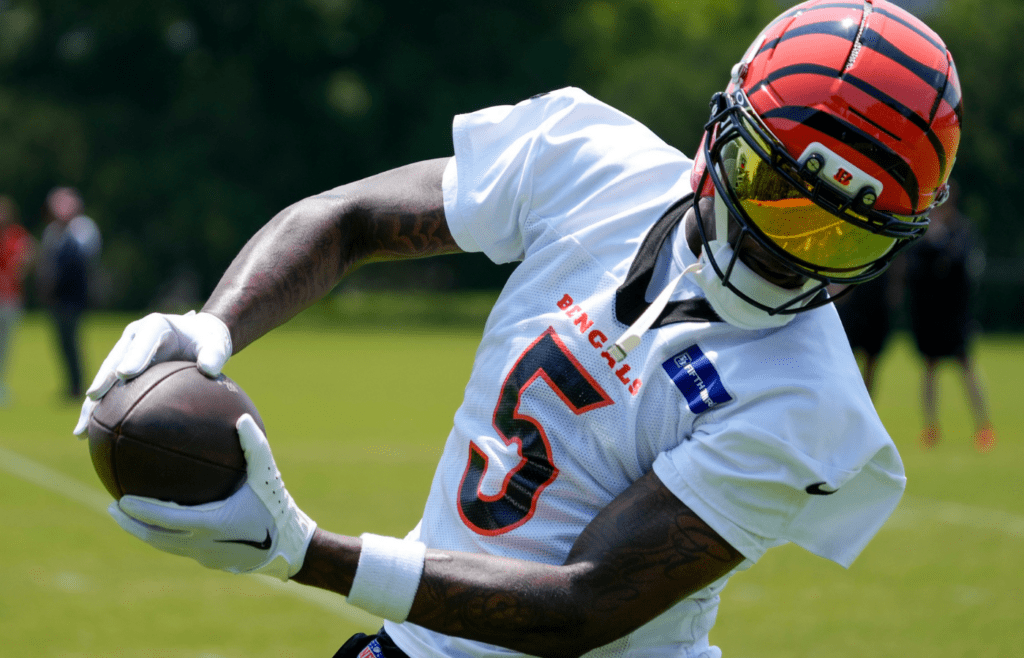 Cincinnati Bengals wide receiver Tee Higgins (5) catches a pass during a session of organized team activities on the Bengals practice field at Paycor Stadium in downtown Cincinnati on Tuesday, June 3, 2025.