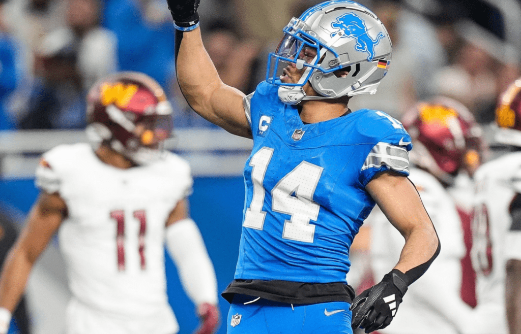 Detroit Lions wide receiver Amon-Ra St. Brown (14) celebrates a first down against Washington Commanders during the first half of the NFC divisional round at Ford Field in Detroit on Saturday, Jan. 18, 2025.