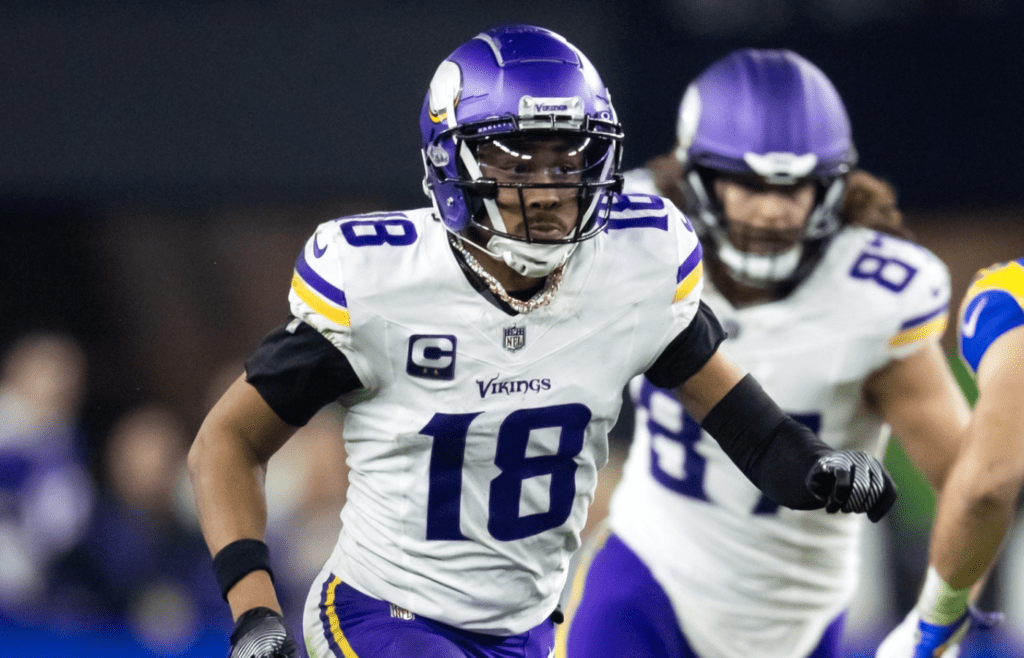 Jan 13, 2025; Glendale, AZ, USA; Minnesota Vikings wide receiver Justin Jefferson (18) against the Los Angeles Rams during an NFC wild card game at State Farm Stadium. Mandatory Credit: Mark J. Rebilas-Imagn Images
