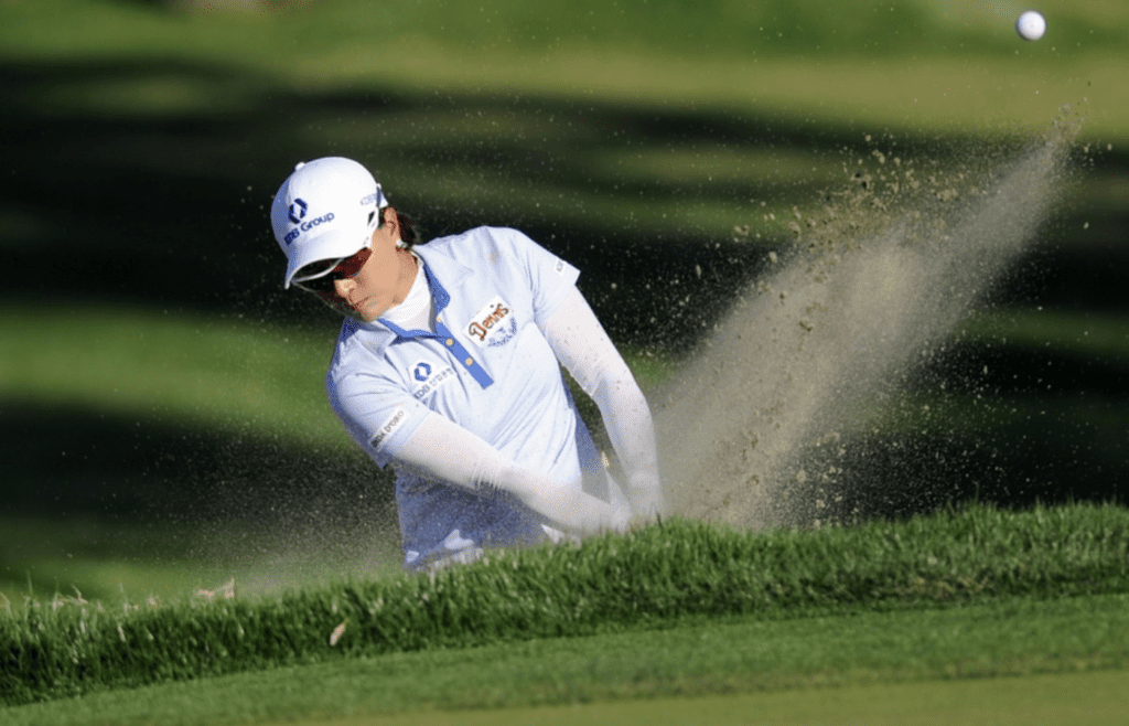 Apr 5, 2014; Rancho Mirage, CA, USA; Se Ri Pak hits out of a bunker on the fifteenth hole in the third round of the Kraft Nabisco Championship golf tournament at Mission Hills Country Club. Mandatory Credit: Kelvin Kuo-Imagn Images