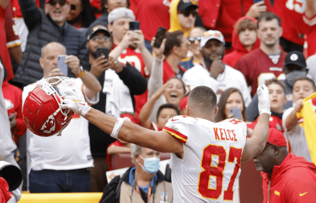 Oct 17, 2021; Landover, Maryland, USA; Kansas City Chiefs tight end Travis Kelce (87) celebrates while leaving the field after the Chiefs' game against the Washington Football Team at FedExField. Mandatory Credit: Geoff Burke-Imagn Images