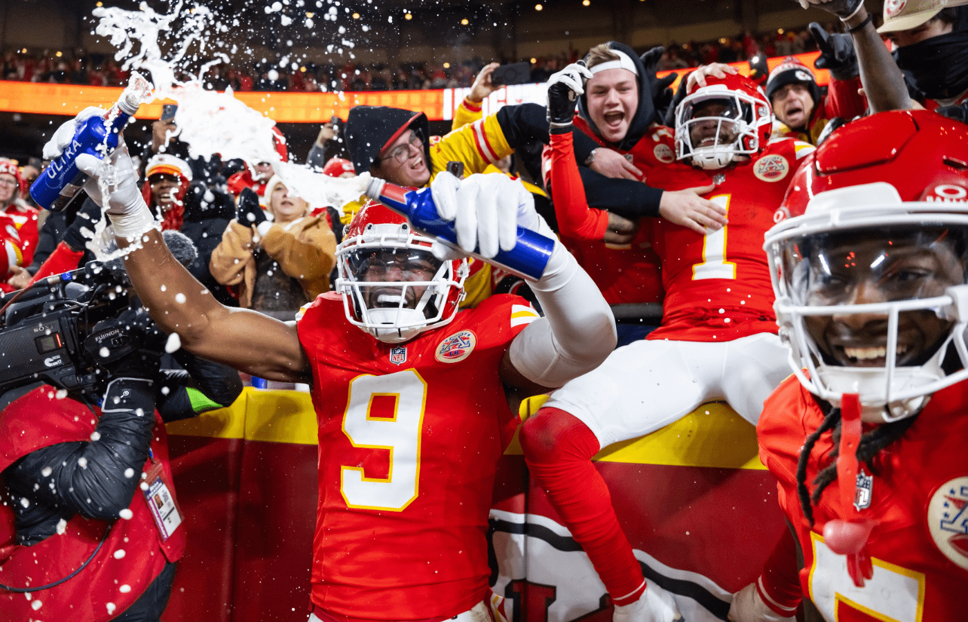 Jan 26, 2025; Kansas City, MO, USA; Kansas City Chiefs wide receiver Xavier Worthy (1) and wide receiver JuJu Smith-Schuster (9) celebrate with fans after a touchdown against the Buffalo Bills during the first half in the AFC Championship game at GEHA Field at Arrowhead Stadium. Mandatory Credit: Mark J. Rebilas-Imagn Images