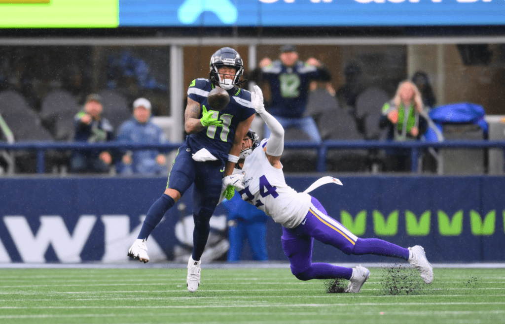 Dec 22, 2024; Seattle, Washington, USA; Minnesota Vikings safety Camryn Bynum (24) breaks up a pass intended for Seattle Seahawks wide receiver Jaxon Smith-Njigba (11) during the first half at Lumen Field. Mandatory Credit: Steven Bisig-Imagn Images