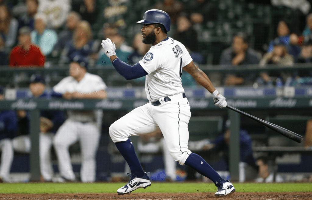 Sep 25, 2018; Seattle, WA, USA; Seattle Mariners left fielder Denard Span (4) hits a two-run double against the Oakland Athletics during the eighth inning at Safeco Field. Mandatory Credit: Joe Nicholson-Imagn Images