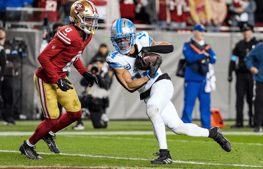 Detroit Lions wide receiver Amon-Ra St. Brown (14) makes a catch for a touchdown against San Francisco 49ers cornerback Renardo Green (0) during the second half at Levi's Stadium in Santa Clara, Calif. on Monday, Dec. 30, 2024.