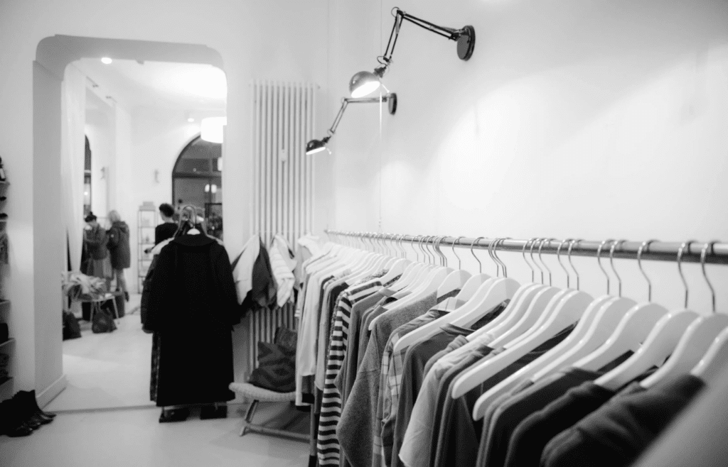 A clothing rack with “from $9.99” signage