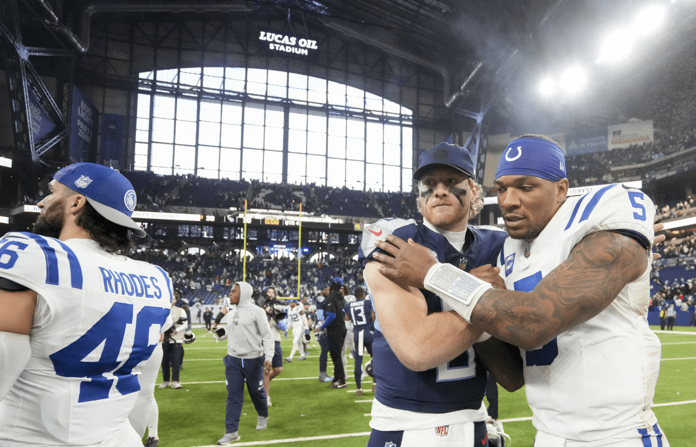 Dec 22, 2024; Indianapolis, Indiana, USA; Tennessee Titans quarterback Will Levis (8) and Indianapolis Colts quarterback Anthony Richardson (5) embrace midfield after a game at Lucas Oil Stadium. Mandatory Credit: Grace Hollars/USA Today Network via Imagn Images