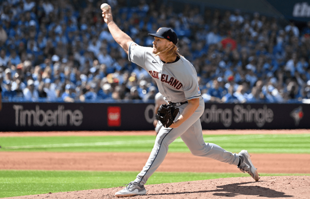 Aug 27, 2023; Toronto, Ontario, CAN; Cleveland Guardians starting pitcher Noah Syndergaard (34) delivers a pitch against the Toronto Blue Jays in the fourth inning at Rogers Centre. Mandatory Credit: Dan Hamilton-Imagn Images