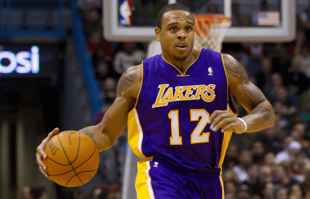 Nov 16, 2010; Milwaukee, WI, USA; Los Angeles Lakers guard Shannon Brown (12) dribbles the basketball during the game against the Milwaukee Bucks at the Bradley Center. The Lakers defeated the Bucks 118-107. Mandatory Credit: Jeff Hanisch-Imagn Images