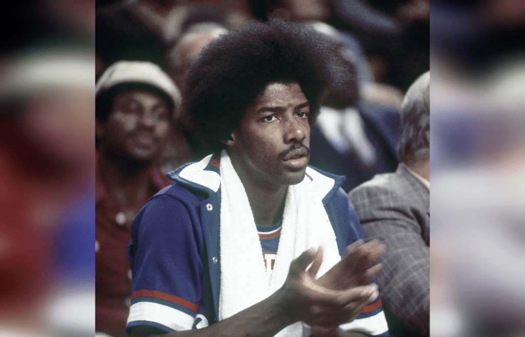 Oct 1976; Unknown location, USA; FILE PHOTO; Philadelphia 76ers forward Julius Erving (6) also known as Dr. J sits on the bench during the 1976-77 season. Mandatory Credit: Tony Tomsic-USA TODAY NETWORK