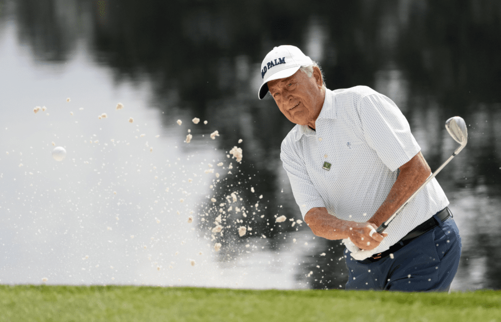 Apr 6, 2022; Augusta, Georgia, USA; Raymond Floyd hits out of a bunker on no. 4 during the Par 3 Contest at The Masters golf tournament at Augusta National Golf Club. Mandatory Credit: Michael Madrid-Imagn Images
