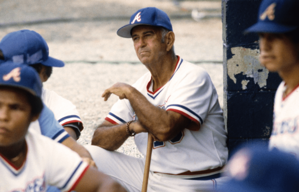 Unknown date and location; USA; FILE PHOTO; Atlanta Braves assistant coach Luke Appling sits in the dugout with players before a game during the 1982 season. Mandatory Credit: Tony Tomsic-USA TODAY NETWORK