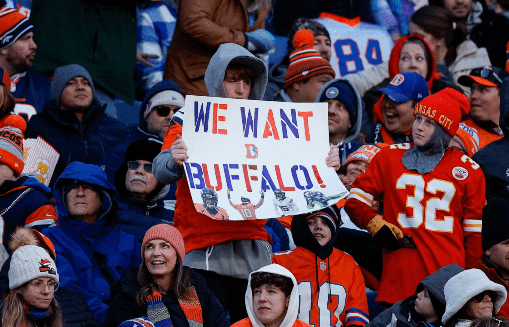 Jan 5, 2025; Denver, Colorado, USA; Denver Broncos fan holds up a sign in the third quarter against the Kansas City Chiefs at Empower Field at Mile High. Mandatory Credit: Isaiah J. Downing-Imagn Images