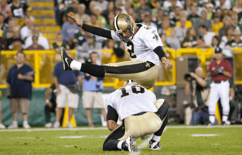 New Orleans Saints kicker John Kasay (2) kicks during the game against the Green Bay Packers at Lambeau Field. The Packers defeated the Saints 42-34.