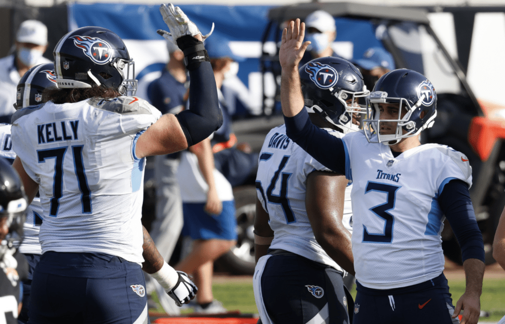Tennessee Titans offensive tackle Dennis Kelly (71) congradulates place kicker Stephen Gostkowski (3) after a field goal during the second half against the Jacksonville Jaguars at TIAA Bank Field.